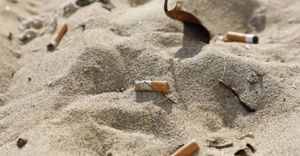Cigarette butts lie in the sand on the beach, Palma, Spain, Jan. 15, 2022. (Getty Images Photo)