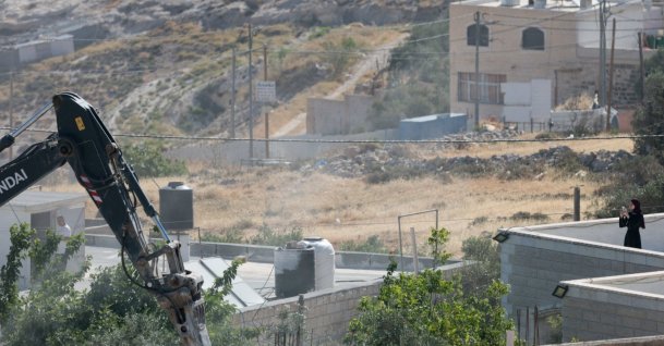 An Israeli military excavator demolishes a Palestinian building in the town of Jabaa in the Israeli-occupied West Bank, near Jerusalem June 3, 2026. (Reuters Photo)