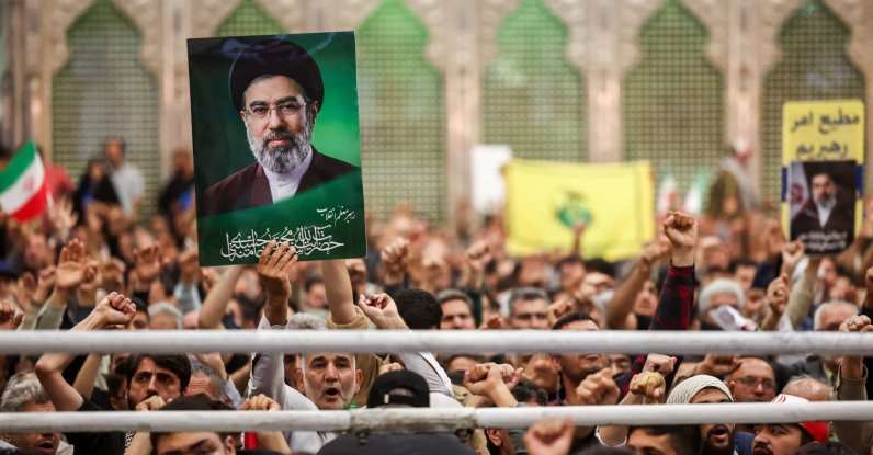 A man holds a placard with an image of Iran's Supreme Leader Mojtaba Khamenei during a ceremony on the 37th anniversary of the death of Ayatollah Ruhollah Khomeini, the leader of Iran's 1979 Islamic Revolution, at Khomeini's shrine in southern Tehran, Iran June 4, 2026. (Reuters Photo)