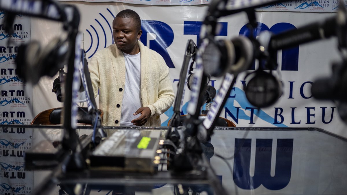 Verite Johnson works at a community radio station, providing daily awareness and updates on Ebola, Bunia, Congo, June 4, 2026. (AP Photo)