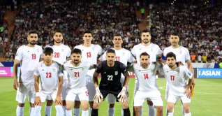 The starting eleven of Iran pose for a team picture during the FIFA World Cup 2026 qualification match between Iran and North Korea in Tehran, Iran, June 10, 2025. (EPA File Photo)