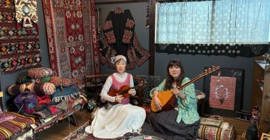 Sachi (L) and Rie Sakamoto of "Yakamoz Duo" pose with instruments, Istanbul, Türkiye, May 14, 2026. (AA Photo)