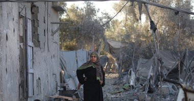 A Palestinian woman stands at the site of an Israeli strike on a house whose residents were warned to evacuate before the attack, Zawaida central, Gaza Strip, Palestine, June 5, 2026. (AFP Photo)