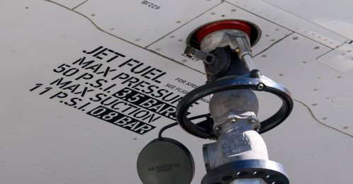 A nozzle attached under the wing of an aircraft during refuelling with jet fuel, Cointrin Airport, Geneva, Switzerland, April 24, 2026. (Reuters Photo)