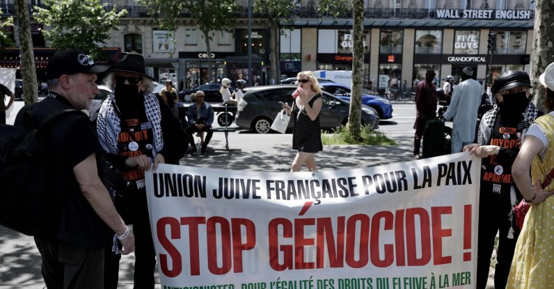 Demonstrators hold a banner reading "French Jewish Union for Peace - Stop Genocide !" as French activists and protesters gather to take part in a demonstration to condemn the Israeli interception of the Global Sumud Flotilla, Paris, May 23, 2026. (AFP Photo)