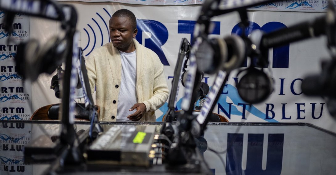 Verite Johnson works at a community radio station, providing daily awareness and updates on Ebola, Bunia, Congo, June 4, 2026. (AP Photo)