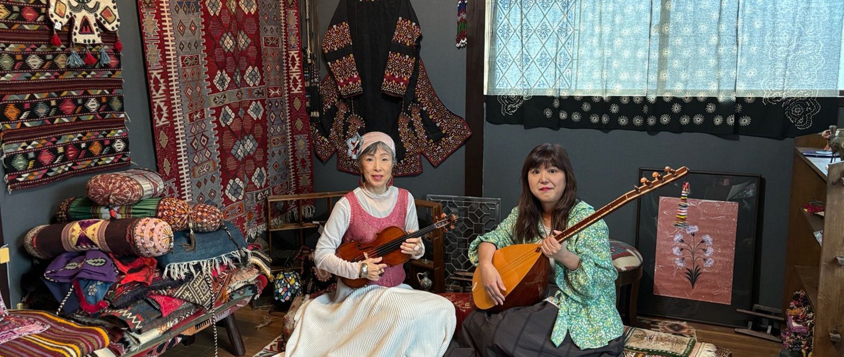 Sachi (L) and Rie Sakamoto of "Yakamoz Duo" pose with instruments, Istanbul, Türkiye, May 14, 2026. (AA Photo)