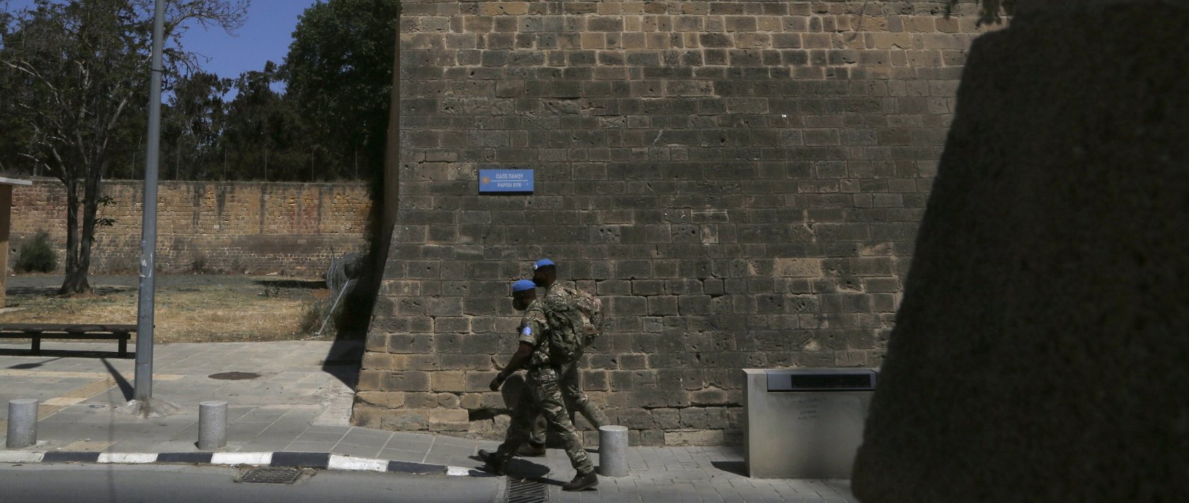 U.N peacekeepers walk by the Venice wall at the medieval core across the U.N buffer zone, in the divided capital Lefkoşa (Nicosia), Cyprus, April 26, 2021. (AP File Photo)