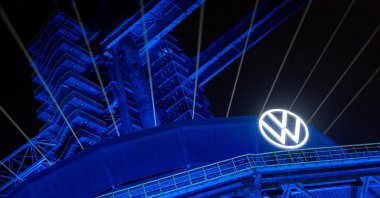A logo of Volkswagen appears on the illuminated preserved blast furnace during the company’s event at Shougang Park, Beijing, China, April 8, 2026. (Reuters Photo)