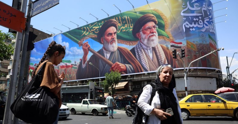 Iranians walk past a huge billboard featuring late Iranian Supreme Leader Ayatollah Ruhollah Khomeini and Supreme Leader Ayatollah Ali Khamenei, in Tehran, Iran, June 7, 2026. (EPA Photo)