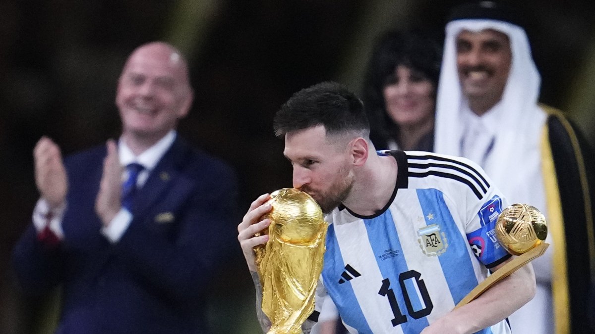 Argentina's Lionel Messi kisses the World Cup trophy after receiving the Golden Ball award for best player of the tournament during the awards ceremony after Argentina defeated France in the World Cup final football match at the Lusail Stadium, Lusail, Qatar, Sunday, Dec. 18, 2022. (AP Photo)