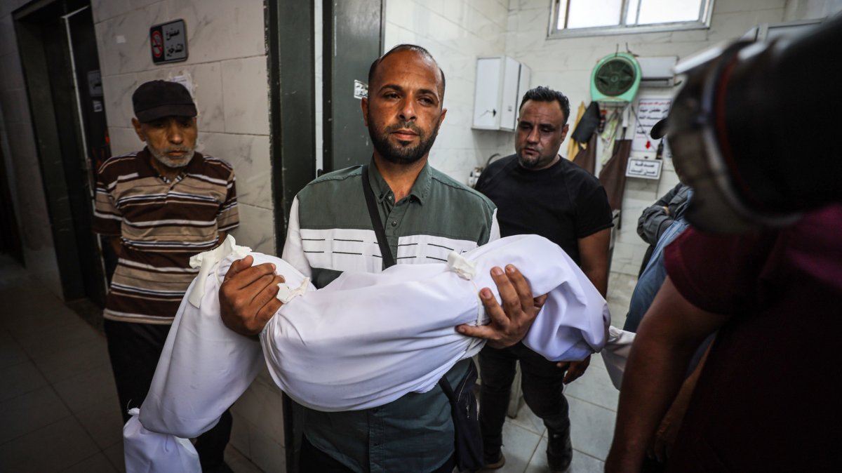 A Palestinian man carries the body of a loved one killed in an Israeli attack on Jabaliya, Gaza, Palestine, June 8, 2026. (AA Photo)