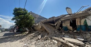A man walks near a collapsed building after a magnitude 7.8 quake in General Santos, Mindanao Island, Philippines, June 8, 2026. (Reuters Photo)
