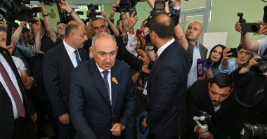 Leader of the Civil Contract party and acting Armenian Prime Minister Nikol Pashinyan (C) casts his vote in parliamentary elections at a polling station in Yerevan, Armenia, June 7, 2026. (EPA Photo)