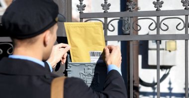 As postal networks modernize, the people behind them remain the foundation of their resilience and continuity. (Shutterstock Photo)