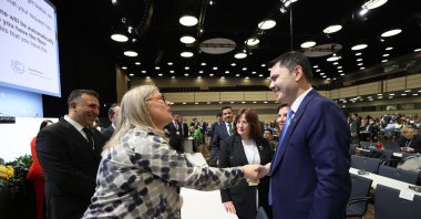 Environment, Urbanization and Climate Change Minister and COP31 President Murat Kurum (R) shakes hands with a counterpart during a climate conference, Bonn, Germany, June 8, 2026. (IHA Photo)