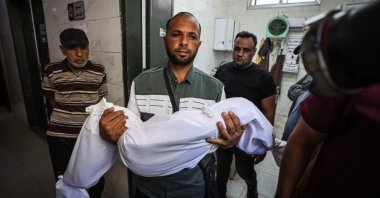 A Palestinian man carries the body of a loved one killed in an Israeli attack on Jabaliya, Gaza, Palestine, June 8, 2026. (AA Photo)