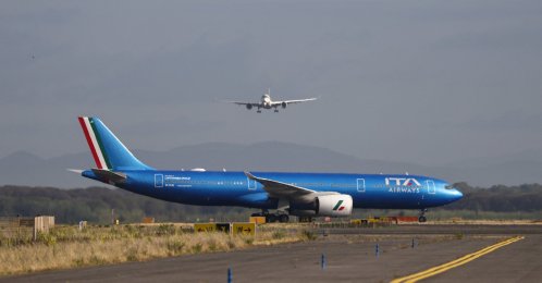 An ITA Airways aircraft stands on the tarmac as another aircraft approaches Rome's Fiumicino airport, in Fiumicino, Italy, June 6, 2026. (Reuters Photo)