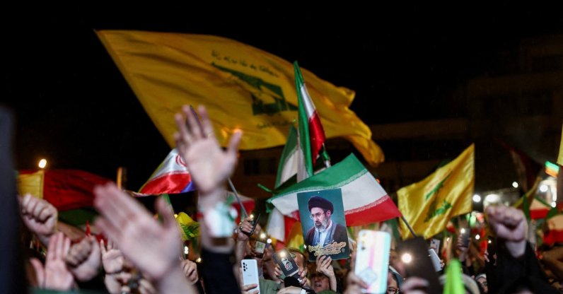 A woman holds an image of Iran's Supreme Leader, Mojtaba Khamenei, during an anti-U.S. and Israeli rally after Iran's missile attack on Israel, Tehran, Iran, June 7, 2026. (Reuters Photo)