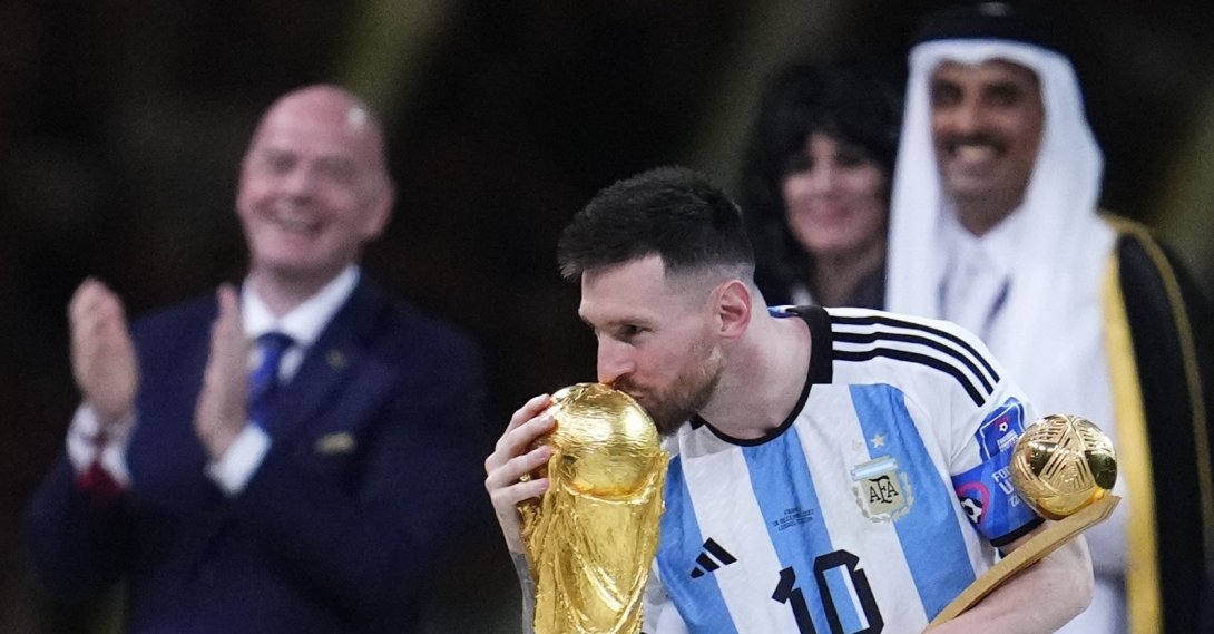 Argentina's Lionel Messi kisses the World Cup trophy after receiving the Golden Ball award for best player of the tournament during the awards ceremony after Argentina defeated France in the World Cup final football match at the Lusail Stadium, Lusail, Qatar, Sunday, Dec. 18, 2022. (AP Photo)