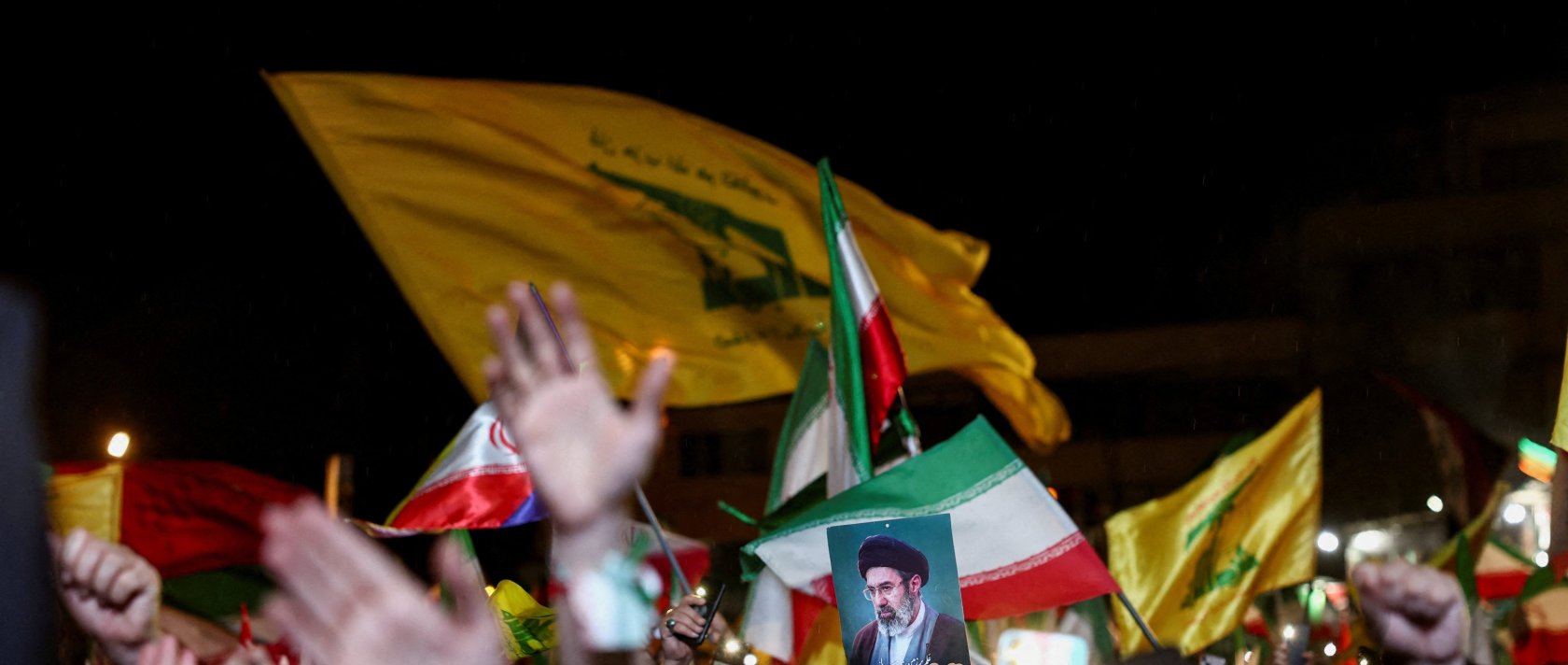 A woman holds an image of Iran's Supreme Leader, Mojtaba Khamenei, during an anti-U.S. and Israeli rally after Iran's missile attack on Israel, Tehran, Iran, June 7, 2026. (Reuters Photo)