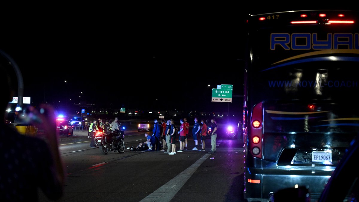 Police secure the area and halt highway traffic as fire and ambulance teams respond, while the Türkiye national football team staff step out of the convoy vehicles to assist at the scene, Mesa, U.S., June 8, 2026. (AA Photo)