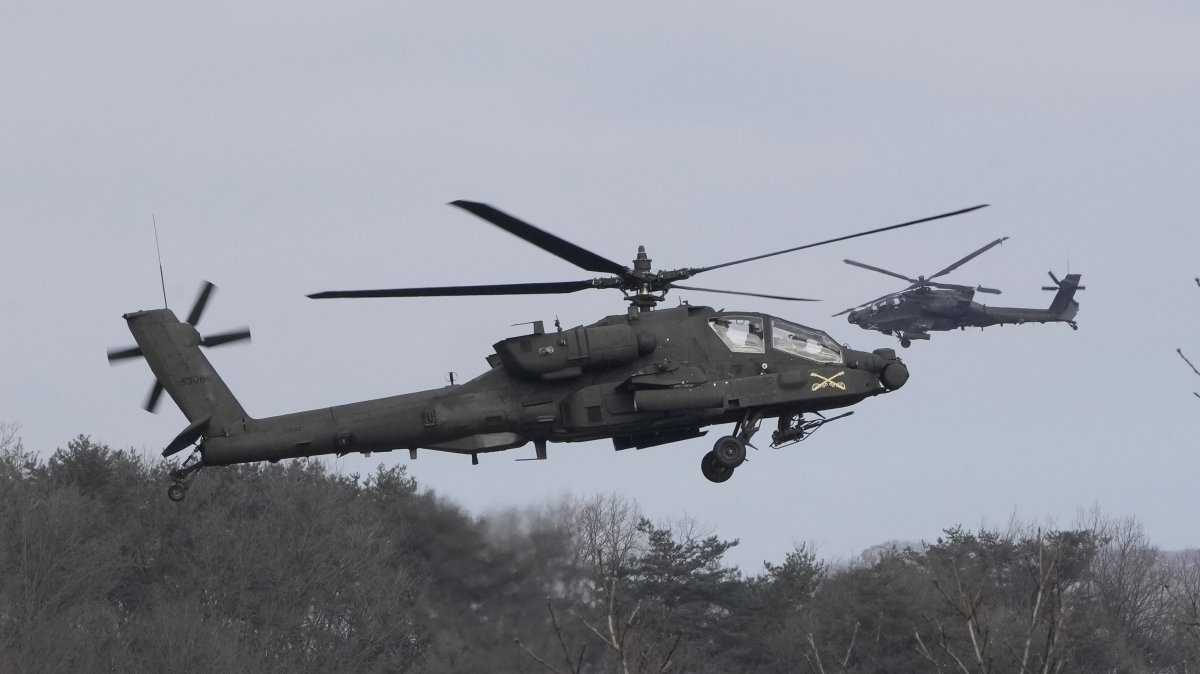 U.S. Army AH-64 Apache helicopters fly during a combined live fire drill with South Korea in Pocheon, South Korea, Feb. 10, 2025. (AP Photo)