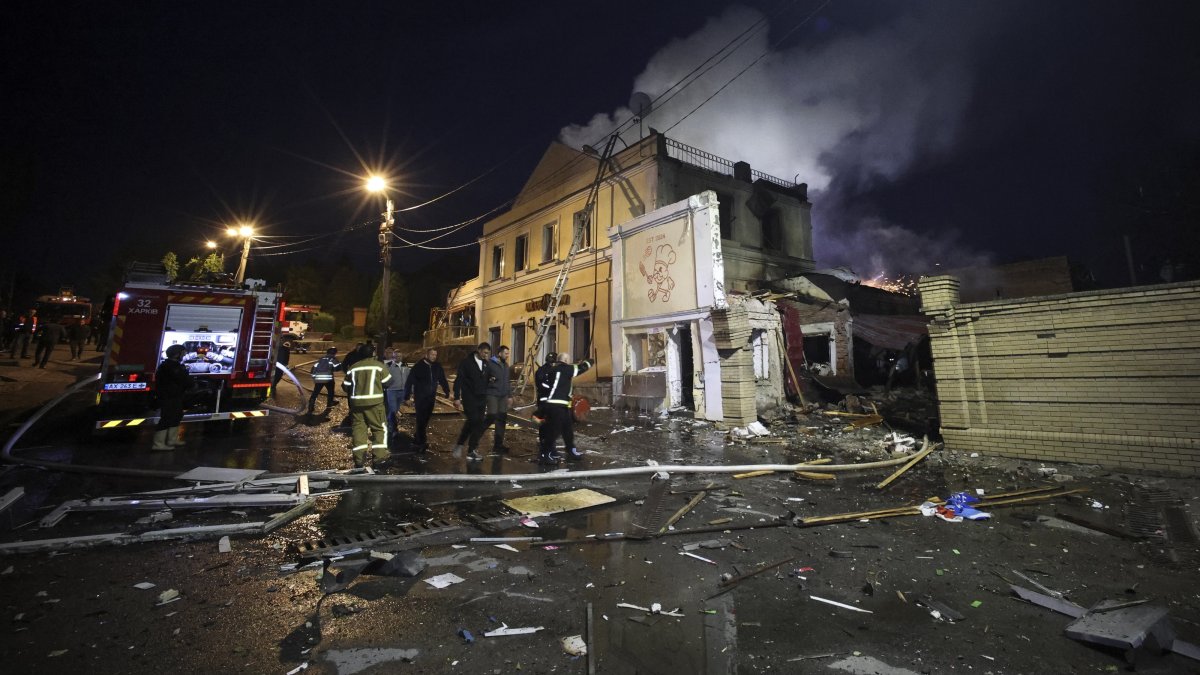 Ukrainian rescuers work at the site of a Russian strike on a residential area in Kharkiv, Ukraine, June 9, 2026. (EPA Photo)