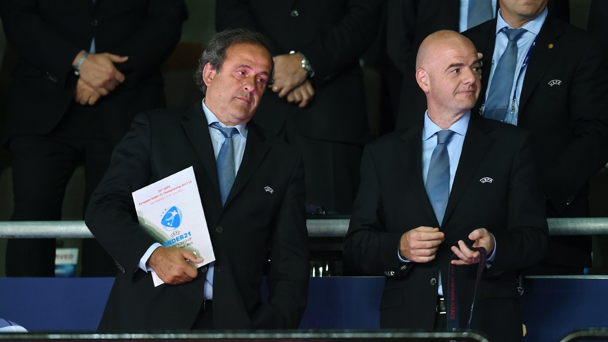 Michel Platini (L) and Gianni Infantino look on during the award ceremony after the UEFA U21 Championship match, Prague
Sweden, June 30, 2015. (Getty Images Photo)