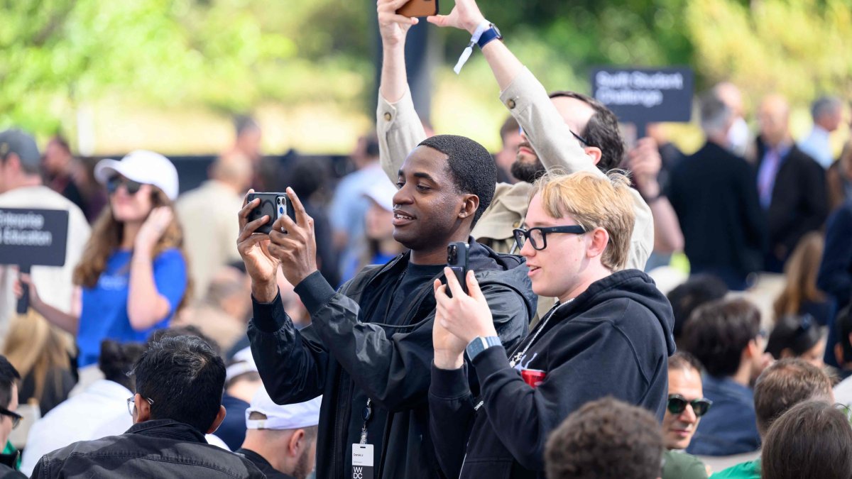 Attendees watch as Apple CEO Tim Cook (not pictured) speaks at his final Worldwide Developers Conference (WWDC) at Apple Park, Cupertino, California, June 8, 2026. (AFP Photo)