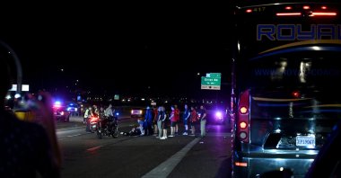 Police secure the area and halt highway traffic as fire and ambulance teams respond, while the Türkiye national football team staff step out of the convoy vehicles to assist at the scene, Mesa, U.S., June 8, 2026. (AA Photo)