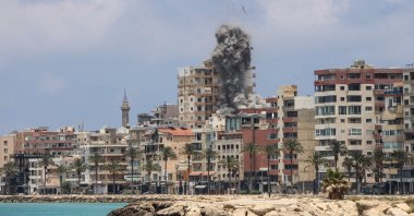 Smoke and debris rise following an Israeli airstrike in Tyre, southern Lebanon, June 9, 2026. (AFP Photo)