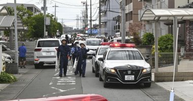 Police are seen at a residential area where a bear showed up in Utsunomiya, north of Tokyo, Japan, June 9, 2026. (AP Photo)