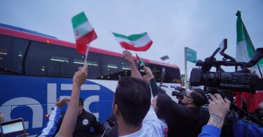 Iran fans look on as Team Iran's bus arrives at the Tijuana International Airport for the 2026 FIFA World Cup, Tijuana, Mexico, June 7, 2026. (Reuters Photo)