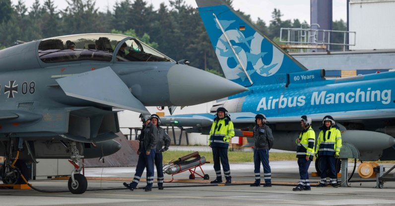 Two Eurofighters are prepared during the Defense Summit 2026 at Airbus Defence and Space GmbH in Manching, Bavaria, southern Germany, May 20, 2026. (AFP Photo)