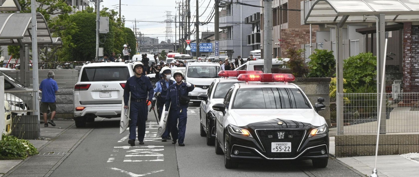 Police are seen at a residential area where a bear showed up in Utsunomiya, north of Tokyo, Japan, June 9, 2026. (AP Photo)