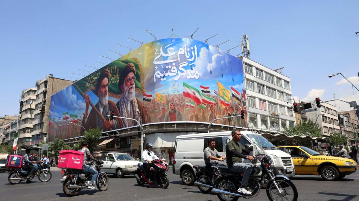 Iranians drive past a large billboard featuring late Iranian Supreme Leader Ayatollah Ruhollah Khomeini and Supreme Leader Ayatollah Ali Khamenei on a street in Tehran, Iran, June 10, 2026. (EPA Photo)