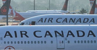 Air Canada planes sit on the runway at Pearson International Airport, Toronto, Canada, Aug. 16, 2025. (AP Photo)