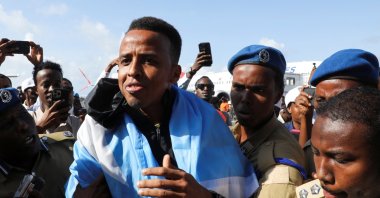 Somali referee Omar Abdulkadir Artan, who had been expected to officiate at matches during the 2026 FIFA World Cup but was denied entry to the United States, is received as he arrives at the Aden Abdulle Osman International Airport, Mogadishu, Somalia, June 10, 2026. (Reuters Photo)