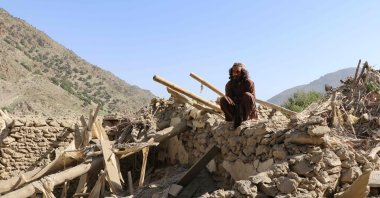 A resident sits atop the wreckage of a damaged house following a Pakistan airstrike at Mani village in Spera district, Khost province, Afghanistan, June 10, 2026. (AFP Photo)