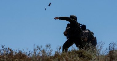 Israeli troops throw stun grenades, as Palestinians protest against a settlement near Hebron in the Israeli-occupied West Bank, Palestine, June 9, 2026. (Reuters Photo)