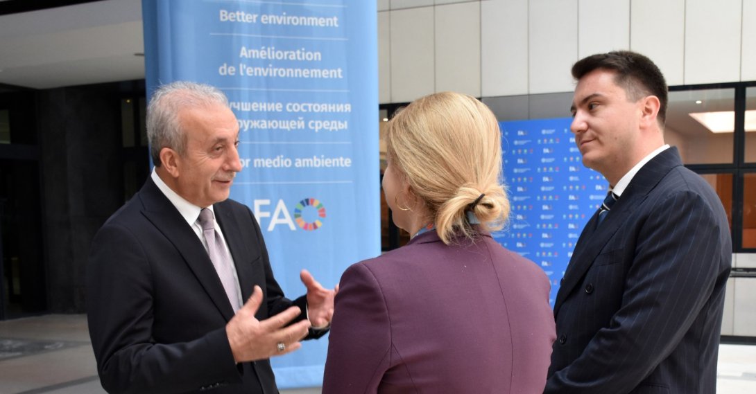 Former Minister of Food, Agriculture and Animal Husbandry Mehmet Mehdi Eker (L) converses with people at the headquarters of the FAO, Rome, Italy, June 10, 2026. (AA Photo)