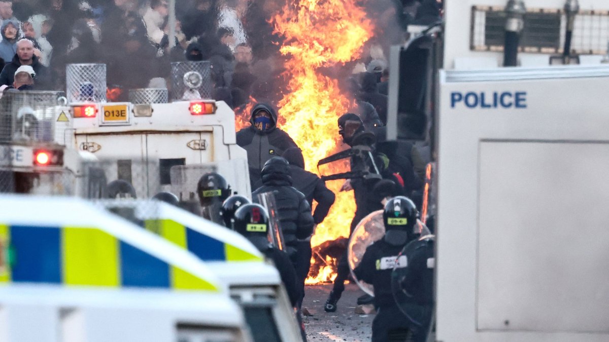 Protesters stand off with police as the former block a road leading to a hotel previously believed to house migrants, in Glengormley, north of Belfast, Northern Ireland, June 10, 2026. (AFP Photo)