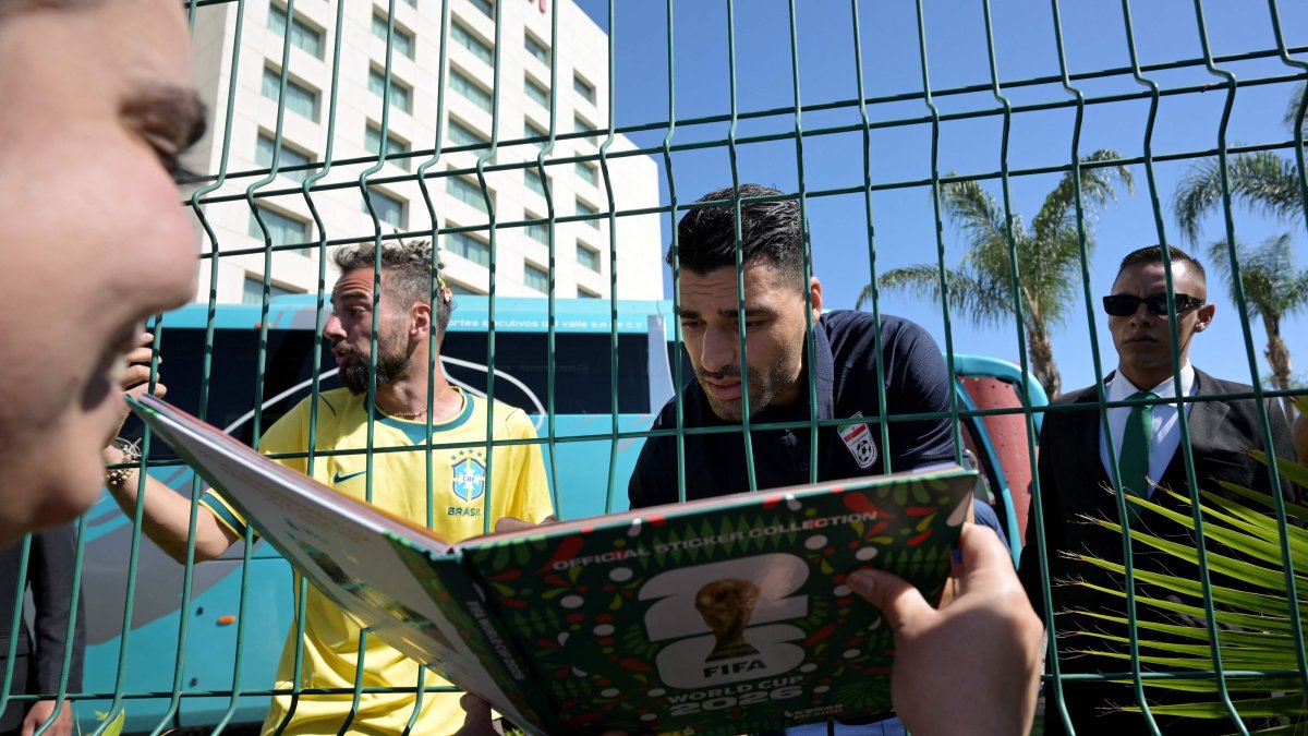 Iran's forward Mehdi Taremi signs autographs for a fan outside the Marriott Hotel before leaving for a training session ahead of the 2026 FIFA World Cup football tournament, Tijuana, Mexico, June 10, 2026. (AFP Photo)