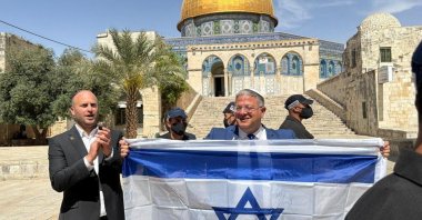 Israeli National Security Minister Itamar Ben-Gvir holds an Israeli flag at the Al-Aqsa compound, East Jerusalem, occupied Palestine, May 14, 2026. (Reuters Photo)