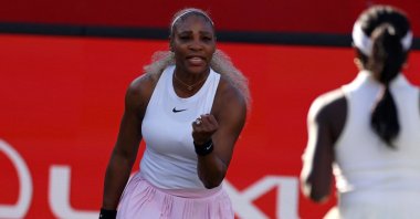U.S. player Serena Williams (L) reacts while playing with Canada's Victoria Mboko against US player Nicole Melichar-Martinez and New Zealand's Erin Routliffe during their round of 16, doubles match at the HSBC WTA tennis Championships at Queen's Club, London, U.K., June 9, 2026. (AFP Photo)