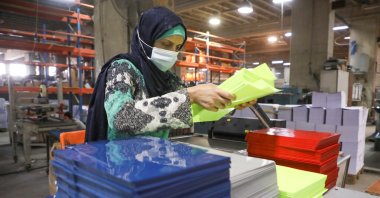 A worker works at Oriental Paper Products, a stationery factory, Fanar, Lebanon, Nov. 1, 2021. (Reuters Photo)