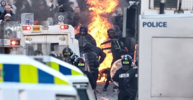 Protesters stand off with police as the former block a road leading to a hotel previously believed to house migrants, in Glengormley, north of Belfast, Northern Ireland, June 10, 2026. (AFP Photo)