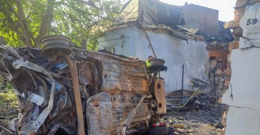 A destroyed car at a site where a house was heavily damaged by a Russian drone strike, amid Russia's attack on Ukraine, Mykolaiv, Ukraine, June 12, 2026. (Reuters Photo)