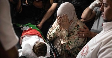 Firyal Abou Haikal, the grandmother of seven-month-old Sam Fahd Abou Haikal, weeps over his body at the Al-Ahli hospital in Hebron, West Bank, Palestine, June 6, 2026. (AFP Photo)
